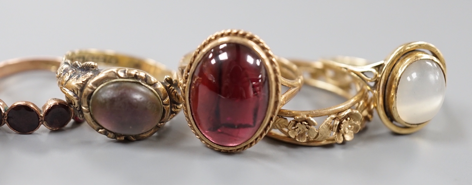 Six assorted Victorian and later 9ct gold or 9ct gold and gem set dress rings, including cabochon garnet and foliate band and a yellow metal and moonstone ring.